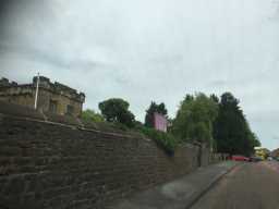 Oblique view of wall in front of Yard to Church of St. Helen July 2016